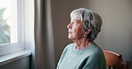 Lonely, senior woman or depression with thinking of memory, mental health or nostalgia with dementia in retirement. Elderly person, window or alzheimer with grief, waiting or remember in nursing home