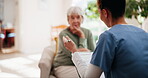 Senior woman, caregiver and talking with clipboard for medical consultation, assessment and medicine plan. Elderly, patient and nurse with document for health questions, surgery schedule and house