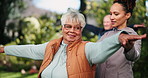 Senior woman, coach and stretching arms for exercise outdoor with healing, rehabilitation training and mobility. Elderly, person and instructor for fitness class, shoulder workout or wellness support