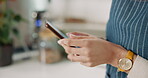 Hands, woman and typing in coffee shop with phone for social media, communication and mobile app review. Waiter, smartphone and working for cafe website, online delivery and customer loyalty program
