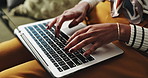 Black woman, hands and typing with laptop for research, online browsing or email on sofa at home. Closeup of young African or female person on computer for communication, web or writing at house