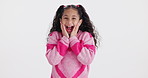 Girl, shock and hands on face in studio with shout, surprise and announcement by white background. Child, wow and portrait for gossip, news and emoji for secret with excited expression in Colombia