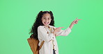 Girl, child and pointing on green screen or mockup for back to school deal, information or excited offer in studio. Face of happy kid in backpack with gesture for news, announcement or presentation