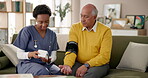 Elderly man, nurse or blood pressure test on sofa for checkup, care or diabetes management. Senior person, caregiver or monitor in nursing home for healthcare, consult or life insurance policy update