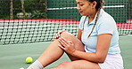 Tennis player, woman and injury to knee on court with pain, accident and sprain during game, match or practice. Sport, athlete and broken leg with medical problem, hurt and sore muscle at training