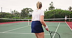 Women, tennis and court with fitness, sports and training with sunshine, exercise and contest. People, outdoor and players with racket, practice and competition with hobby, wellness and recreation