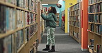 Girl, checking and library with bookshelf for knowledge, story or learning literature at bookstore. Young female person or teenager looking for reading novel, story or information by bookcase at shop