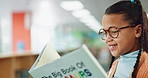 Child, reading and library book with school, learning and youth development with literature. Young girl, smile and study with story, education and knowledge for class with growth and language skills