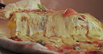 Pizza, slice and take away with melted cheese in gourmet restaurant for cuisine, meal or snack. Cooking, eating and fast food with lunch closeup on table for cafe hospitality, hunger or service