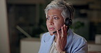 Mature woman, call center or headset at night for info, business or problem solving in office. Customer support, bilingual agent or frown in dark for chat, advice or telehelp for international client