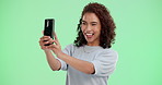 Woman, smile and selfie by green screen for online blog update, photo album and network. Girl, influencer and profile picture for social media post, happy memory and connection by studio background