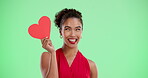 Face, smile and woman with heart on green screen for valentines day, flirt gesture and relationship connection. Happy, female person and love sign for inspiration of romance date on studio background