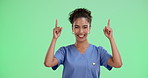 Happy woman, nurse and pointing with green screen for advertising or marketing on a studio background. Portrait of female person or medical employee with smile for alert, notification or mockup space