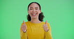 Woman, face and thumbs up on green screen in studio for positive vote or review, agreement and affirmation. Girl, portrait and hand gesture or yes sign for approval, well done and good reputation.