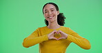 Heart, green screen and woman with smile, portrait and symbol for love with hands, happy and space. Banner, emoji and finger shape for support, mockup and sign of kindness, peace or studio background