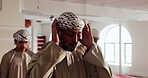 Culture, mosque and prayer with Arabic people in temple together for belief, faith or religion. Allah, hajj and ramadan kareem with Muslim men praying for Eid Mubarak or holy commitment to tradition