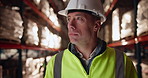Businessman, helmet and contractor with inspection in warehouse for stock control or quality assurance. Man or employee in logistics with hard hat for monitoring shippment, supply chain or cargo