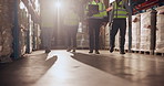 Business people, walking and logistics with team in storage warehouse for stock control or quality assurance. Group of employees or contractors strolling in supply chain, distribution or shipment