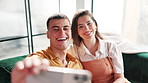 Selfie, happy and couple on sofa with smile for social media, profile picture and bonding. Dating, love and man and woman on couch take photo for website post, update and online for relationship