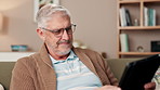 Senior man, tablet and smile in home for news, travel planning and comfortable retirement. Elderly person, tech or reading on sofa for family memories, pension fund or online banking in living room