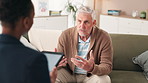 Senior man, depression and talking to therapist for mental health, consultation and help in office. Patient, discussion and psychologist with tablet for counseling notes, trauma support and advice