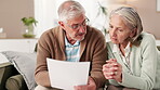 Senior couple, home and discussion with documents for retirement plans, saving and investment. People, relationship and deciding in living room with paperwork for life insurance or policy cover