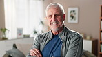 Portrait, confidence and happy senior man in nursing home to relax with pride, smile and funny laugh. Face, retirement and person with arms crossed in living room for health or wellness in Canada