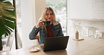 Woman, coffee and drink with laptop at cafe for morning beverage, start or caffeine at indoor restaurant. Young female person with smile for warm latte, cappuccino or espresso on computer at shop