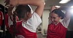 Conversation, happy and soccer player women stretching at venue for game, match or sports. Exercise, fitness and smile with football friends speaking for in locker room for competition or teamwork