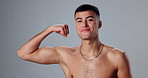 Face, flexing and man with wellness, bicep and workout with bodybuilder on gray studio background. Portrait, person and model showing muscle, training and fitness with confidence, pride and athlete