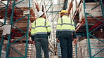 Logistics, discussion and men in warehouse together for inspection, supply chain and inventory management from back. Teamwork, planning and people in factory for quality control in cargo distribution