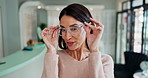 Woman, face and happy with glasses for eye care in store with laughing, pout and excited for prescription lens sale. Optometry, person or portrait with eyewear, spectacles or new frame for healthcare