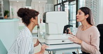 Happy woman, optometrist and eye exam with machine for optical test, vision or sight at optometry. Female person or optometric physician helping customer for optic examination on ophthalmic equipment