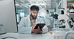 Science, laboratory and man on computer and tablet for medical study, online research and website. Healthcare, biotechnology and scientist on tech for vaccine development, experiment and medicine