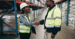 Business people, team and handshake with partnership at warehouse for deal, agreement or logistics. Businessman and woman shaking hands for storage, supply chain or distribution together at depot