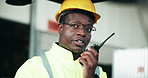 Walkie talkie, construction and black man talking for communication, inspection and maintenance. Engineering, distribution and worker with radio for planning, building infrastructure and logistics