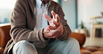 Senior man, hand pain and arthritis for joint inflammation, muscle injury and fibromyalgia. Elderly person, finger massage and medical problem in home with osteoporosis, carpal tunnel risk and ache
