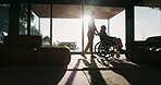 Caregiver, silhouette and elderly man with wheelchair for rehabilitation, service and window sunshine. Retirement home, woman and person with disability for assisted living, help and recovery support