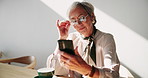 Relax, reading and old woman in cafe with phone, cappuccino and glasses on calm retirement holiday. Smile, smartphone and happy senior person in coffee shop with mobile app for connection with drink