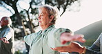 Help, personal trainer and stretching with senior yoga class outdoor in city for exercise or wellness. Assistance, mobility or pilates and elderly people with coach for balance or rehabilitation