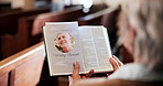 Funeral, church and person with pamphlet and bible for memorial service, sermon and ceremony. Religion, death and sad woman in congregation with obituary for mourning, memory and prayer in chapel