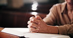 Closeup, hands and woman with prayer, bible and faith with religion, guidance or belief. Person, Christian or follower with scripture, praise or holy book with forgiveness, peace or worship with hope