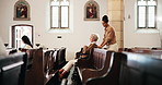 Elderly, woman and wheelchair with caregiver in church for assistance, talking and Sunday service. Senior person, walking and mobility support in chapel for spiritual sermon, christianity and helping