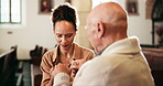 Belief, holding hands and people in prayer at church together for Christian religion, devotion or support. Faith, praying or trust in God with Catholic pastor and woman in holy temple for confession