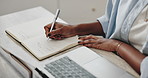 Black woman, hands and writing notes in book for agenda, laptop and remote work schedule in home. African entrepreneur, computer and diary for planning online course, translation service and research