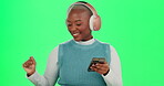 Green screen, black woman and dancing with headphones or smartphone for music, fun and audio. Female person, smile and happy with streaming service or subscription on website for entertainment