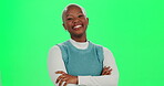 Arms crossed, happy and smile of woman on green screen in studio for advertising or marketing. Brand ambassador, confident and girl power and portrait of African person on mockup space for promotion