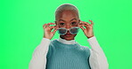 Black woman, green screen and smile for fashion with sunglasses for trendy style, outfit and clothes. Female person, portrait and happy or laugh with excitement for streetwear eyewear and accessory