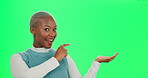 Black woman, pointing and green screen for presentation, advertising and mockup space with hand. Fashion, promotion and branding for product placement, deal and marketing with discount in studio