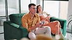 Man, couple and play game with controller for virtual gaming, esports challenge and streaming contest on sofa. People, relax and digital device for arcade competition, bonding and house together